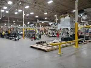 A warehouse with many machines and equipment in it.